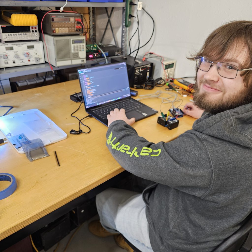 Intern working on his arduino-based memory flashing project