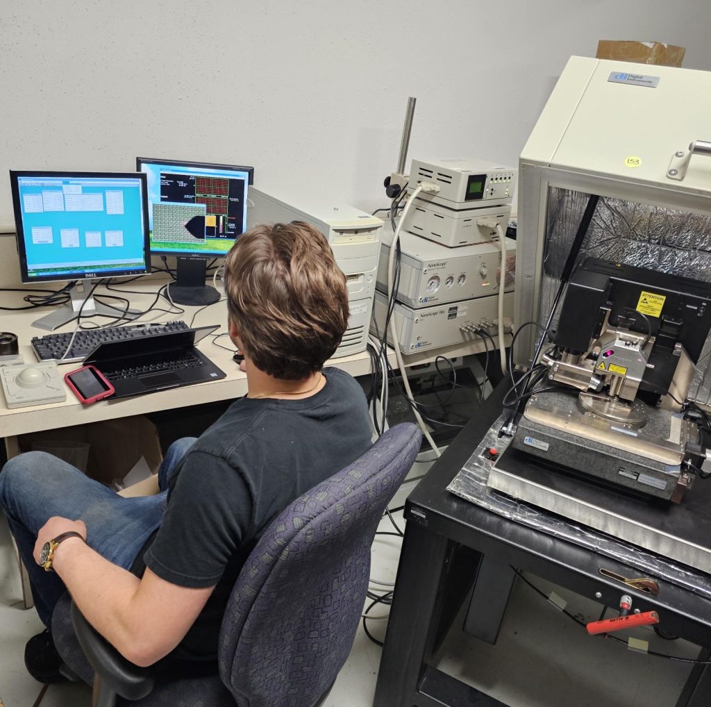 Equipment Coordinator working on an atomic force microscope project.